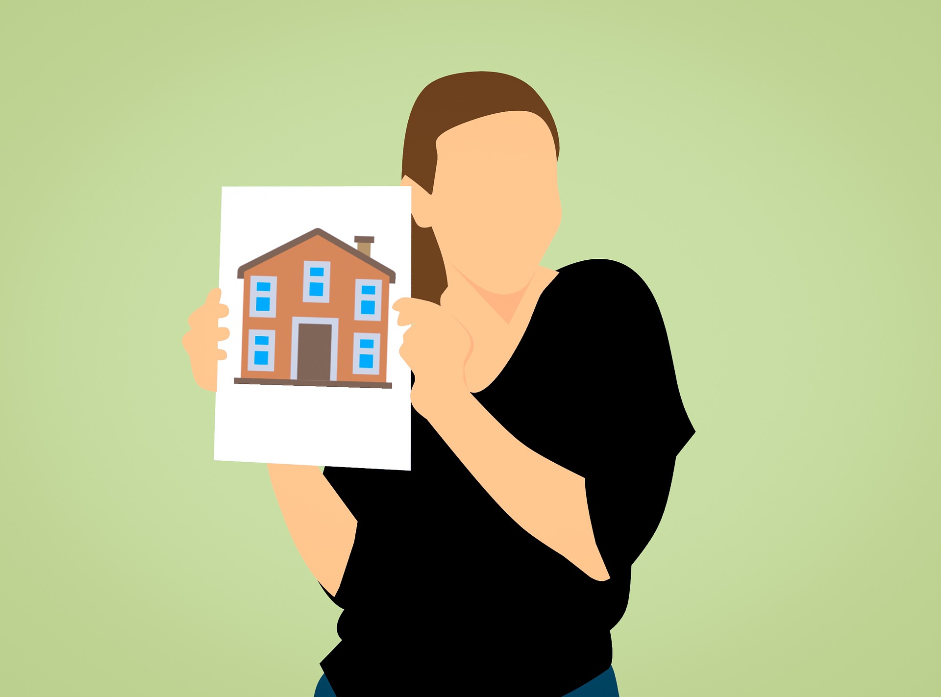 a woman holding a picture of a house